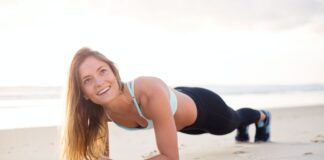 woman exercising bear body of water